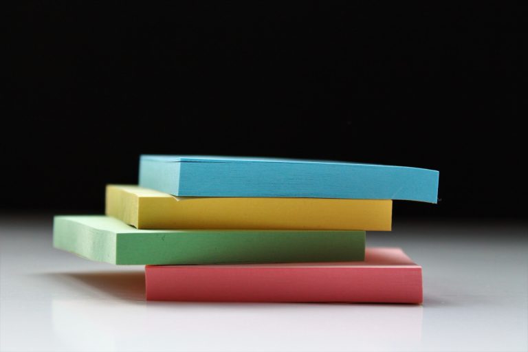 four assorted-color sticky notes